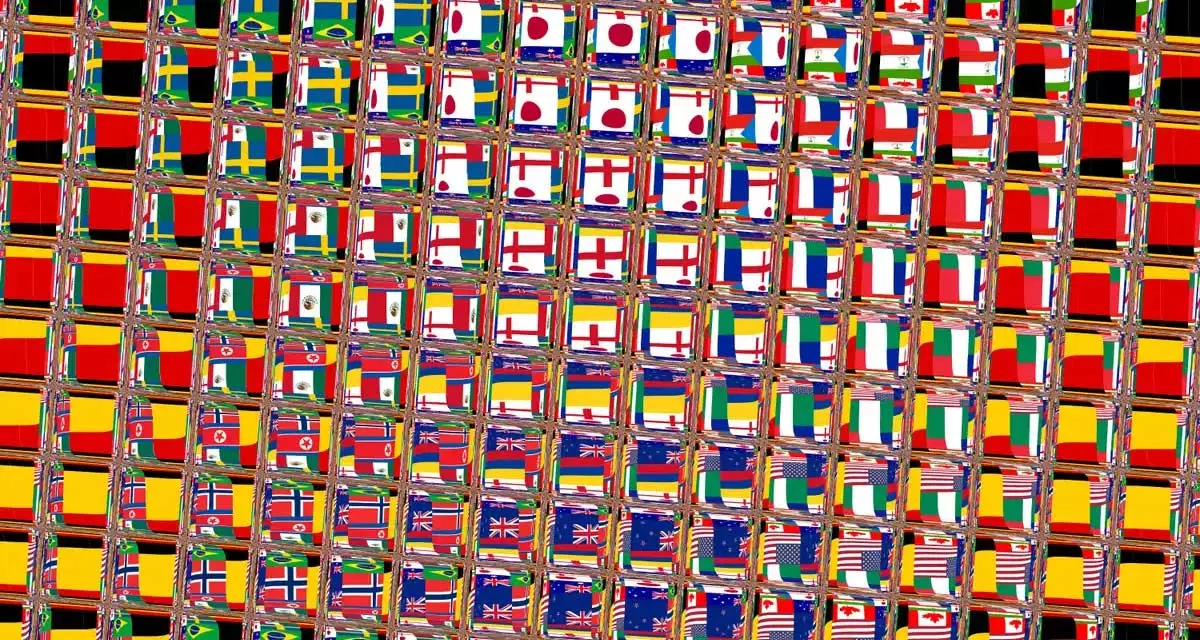 Symbolbild: Buntes Raster aus verschiedenen Flaggen. Foto: pixelio.net | Wilhelmine Wulff